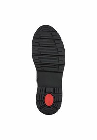 Black rubber shoe sole with deep treads, featuring a red circular accent in the center. Size 37 marked on the side.