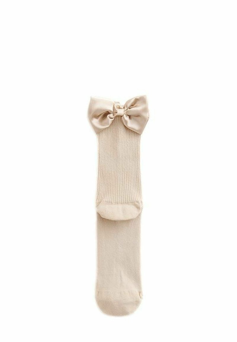 Beige Rippensocken mit einer Satin-Schleife am Bund. Das Material ist weich und hat eine glatte Textur, ideal für die Freizeit.