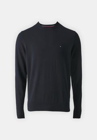 Marineblå langermet genser laget av myk stoff, med rund hals og en liten logo på brystet. Glatt tekstur, ribbede mansjetter.
