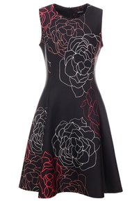 Svart ärmlös klänning med stora konturerade blommönster i vitt och rött. En utsvängd kjol och dragkedja bak.