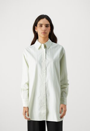 Light green button-up shirt with vertical white stripes, long sleeves, and a classic collar. Smooth fabric, tailored fit, and subtle sheen.