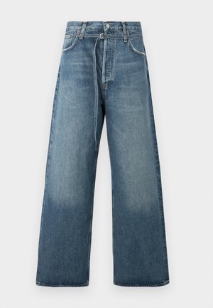 Wide-leg blue jeans in a faded wash, crafted from denim with visible stitching accents and a button fastening at the waist.