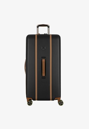 Schwarzer Hartschalenkoffer mit sandfarbenen Akzenten, glatter Oberfläche, ausziehbarem Griff und vier Rädern. Zentrales Griff und kreisförmiges Logo-Detail.