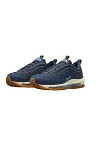 Navy blue sneaker with a textured upper, air cushion sole, and gum rubber outsole. Features green and purple accents and a streamlined design.