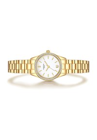 Kuldtooni kell, millel on ümar valge kellaplaat, kullast näputipsud ja tunni markerid. Ümbritsetud kristallidega kaunistatud raamist ja ühendatud rihmaga.