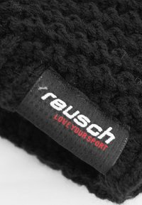 Black knitted fabric with a textured surface. A black label displays "reusch" in white and "LOVE YOUR SPORT" in red.