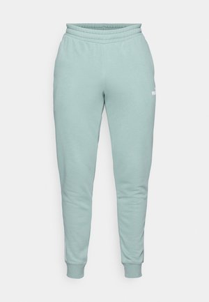 Light green sweatpants made of soft fabric. Feature an elastic waistband, tapered legs, and a small logo accent on the side.