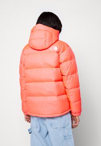 The North Face Gewatteerde jas - brilliant coral