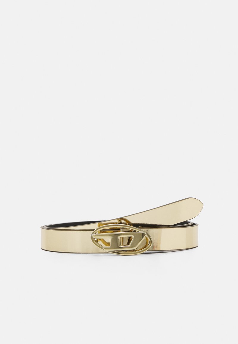 Gold metallic belt with a glossy finish, featuring a circular buckle with an oval cutout, and a smooth texture. Adjustable length.