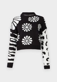 Knit sweater with a black body featuring white floral and zebra stripes on one sleeve. The other sleeve has a leopard print design. Cropped fit.