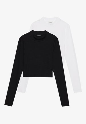 Set di due top a maniche lunghe, corti, in bianco e nero. Realizzati in tessuto morbido con scollatura rotonda e silhouette aderente.