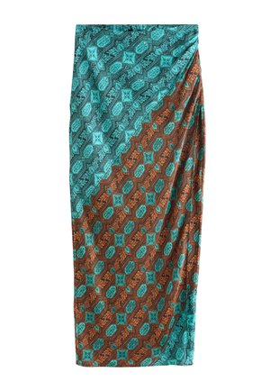 Jupe longue avec motif à découpe diagonale en bleu sarcelle et marron, avec des motifs géométriques et floraux.