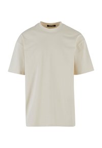 Light beige t-shirt made from cotton, featuring a round neckline and short sleeves, with a smooth texture and minimal design elements.