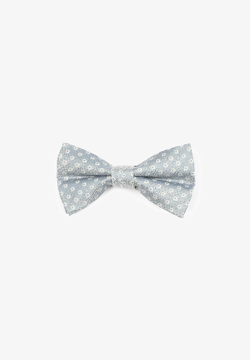 Helles blaues Stofffliegen mit strukturiertem Muster und kleinen weißen Punkten, ausgestattet mit einem zentralen Knoten und leicht spitz zulaufenden Enden.