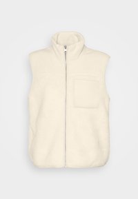 Kamizelka polarowa w kolorze ecru, z wysokim kołnierzem, pełnym zamkiem z przodu oraz jedną kieszenią na piersi. Miękka, teksturowana powierzchnia.