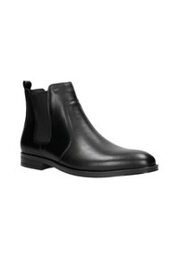 Stivale Chelsea in pelle nera con pannelli elastici laterali, punta rotonda, superficie liscia e tacco basso a blocco. Branding sottile sulla parte superiore.