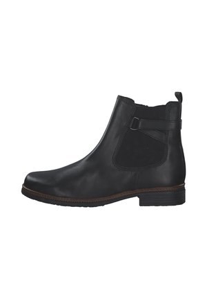 Bottine en cuir noir avec des panneaux élastiques sur les côtés, une languette de tirage et une semelle en caoutchouc texturée. Elle présente une forme élégante et un design minimaliste.
