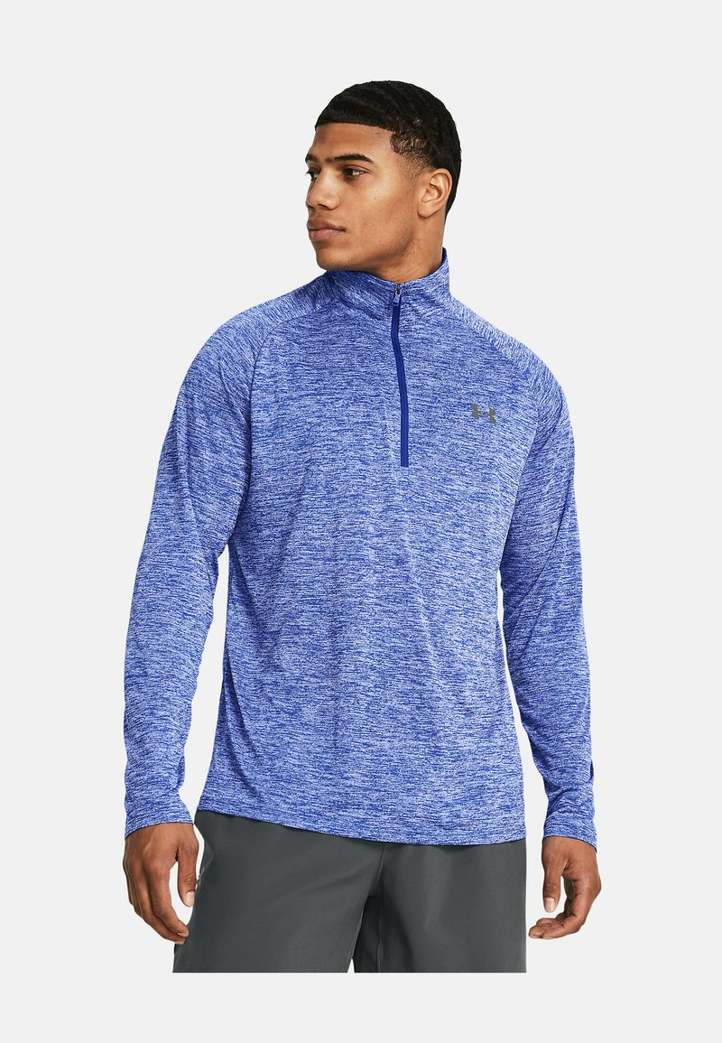 Blauwe sportieve lange mouwen shirt met een half-rits kraag, textuurstof en logo op de borst. Het shirt heeft een gemêleerd patroon.