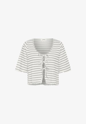 Lühikeste varrukatega, valge ja mustade horisontaalsete triipudega lühike topp, millel on ümar kaelus ja eesmine lipsuga sulgus. Tootel on lainelise serva ja varrukate disain.