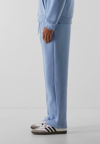 9N1M SENSE SENSE ESSENTIAL FLUFFY - Treniņtērpa apakšdaļas - powderblue