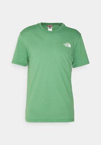 Green cotton t-shirt with a crew neck, short sleeves, and a white logo on the left chest. Smooth texture, regular fit.