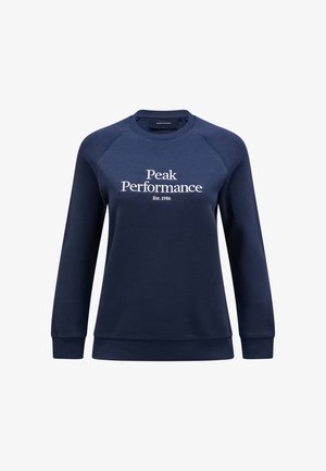 Felpa blu navy realizzata in tessuto morbido, con scollo rotondo, polsini e orlo a coste, con testo bianco che recita "Peak Performance Est. 1986."
