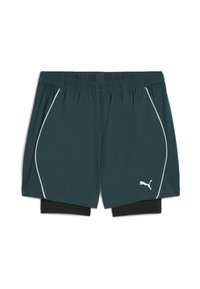 Donkerblauwe Puma sportshorts met zwarte binnencompressielaag, elastische tailleband en witte piping langs de zijkanten op een witte achtergrond.