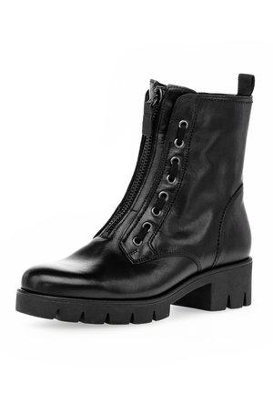 Black leather ankle boot with a side zipper, lace-up detail, chunky heel, and textured sole. Features silver eyelets and a pull tab.