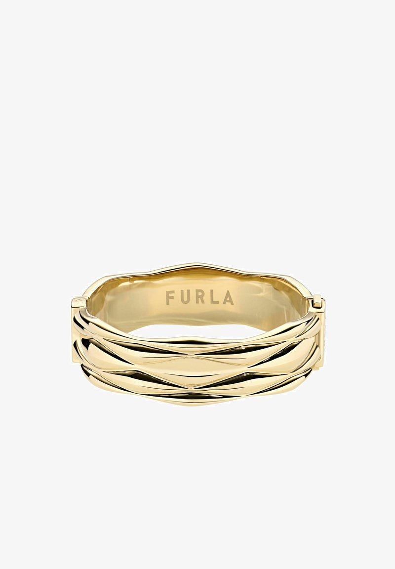 Kuldse tooni käevõru keeruka kujundusega. Sile ja poleeritud viimistlus, mille siseküljel on graveeritud kaubamärgi nimi "Furla".