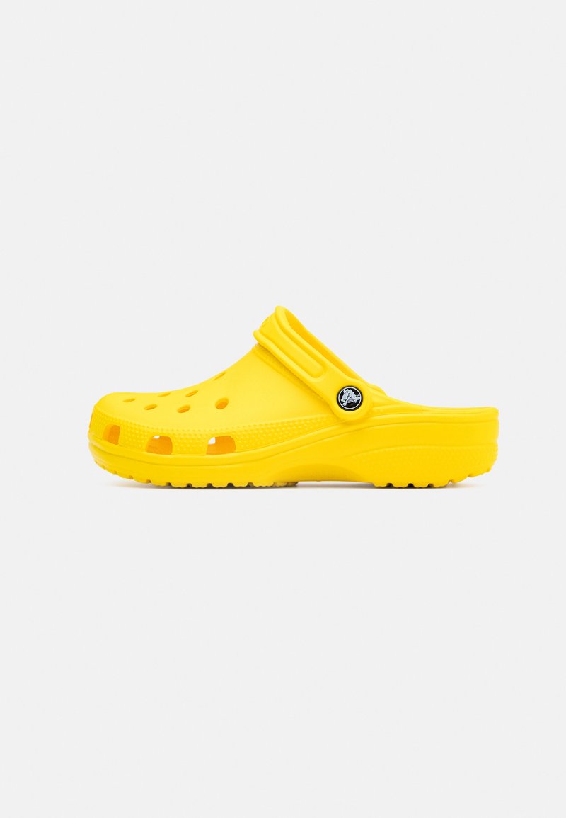 Yellow rubber clogs featuring an open design, ventilation holes, a flexible back strap, and textured sole for grip.
