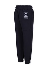 Marine fleece joggers met een elastische tailleband, zijzak en een Timberland logo patch. Tapered leg ontwerp met geribbelde manchetten.