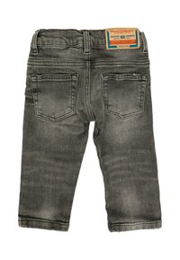 Jeans per bambini neri sbiaditi con due tasche posteriori e un'etichetta Diesel Industry cucita sulla cintura.