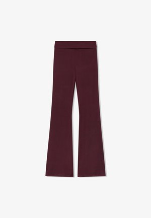 Pantaloni svasati color bordeaux con un ampio elastico in vita. Tessuto liscio ed elasticizzato con una silhouette elegante e senza cuciture visibili o decorazioni.