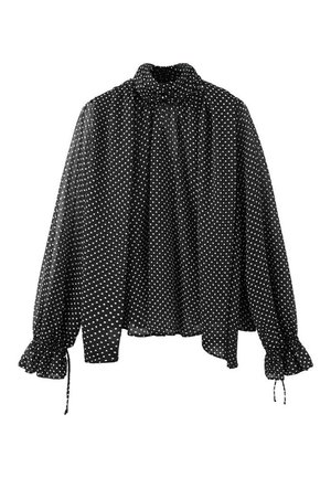 Blusa negra de manga larga con lunares blancos, cuello alto, corte holgado y puños fruncidos con lazos en las mangas.