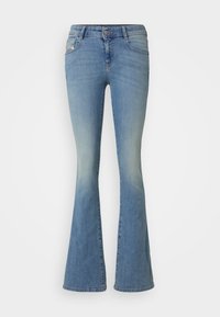 Ljusblå jeans i denim med utställda ben och midjahöjd, med klassisk design med fem fickor och subtil blekning fram och bak.