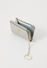 Light gray zippered wallet made of textured material, featuring a blue interior, gold hardware, and a chain with a keyring attachment.