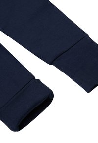 Marineblauwe sweatshirtmanchetten van een zachte katoenmix, met geribbelde textuur en een recht gesneden ontwerp zonder extra versieringen.