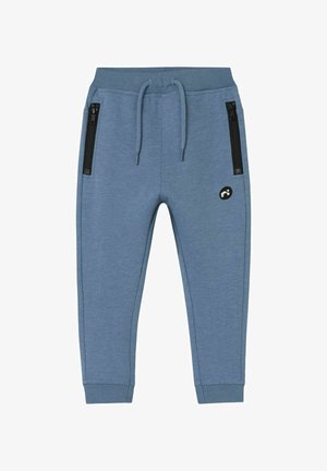 Blauwe sportbroek van zacht materiaal, met een elastische tailleband, trekkoord en twee zijzakken met rits in zwart accent.