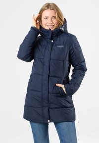 Navy blue puffer coat with a high collar, horizontal stitching, zipper front, and pockets. Features an adjustable drawstring hood.
