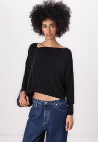 DRYKORN SOMY - Pikkade varrukatega topp - black