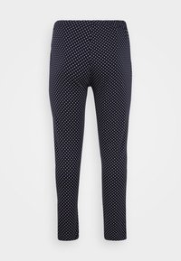 Navy Leggings mit weißen Punkten, ausgestattet mit einem dehnbaren Bund und einer glatten, weichen Stoffoberfläche. Figurbetonte Silhouette, in voller Länge.