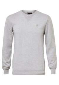 Harmaa neulepusero, jossa on pitkät hihat, pyöreä kaula-aukko, ribbitekniikalla tehdyt hihansuut sekä teksturoitu V-ompelu kaula-aukolla. Huomaamaton brändilogo rinnassa.