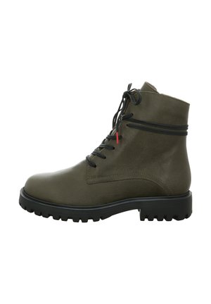 Olivgrüne Lederstiefeletten mit schwarzem Gummisohle, runder Zehenform und Schnürdesign. Mit einem schwarzen Akzentband um den Knöchel.