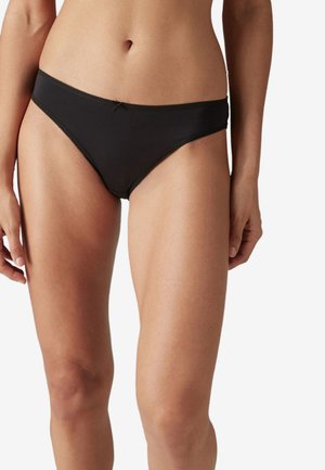 Zwarte bikini slipjes met een gladde textuur, lage snit en contrasterende dunne stiksels. Heeft een kleine strikaccent aan de voorkant.