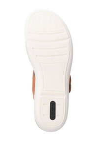 Semelle en caoutchouc blanc avec des grips texturés, présentant un logo "remonte" noir. Le côté montre un matériau supérieur en cuir marron.