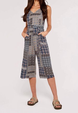 Blauw jumpsuit met patroon, v-hals, brede cropped pijpen, zijzakken en verstelbare bandjes; met geometrische en bloemmotieven.
