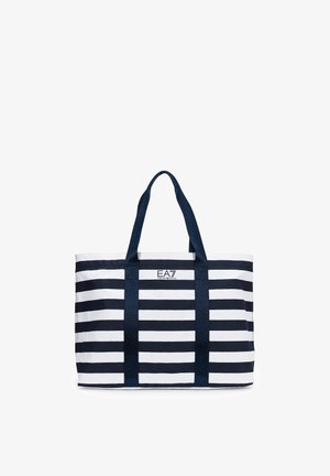 Blauw-wit gestreepte draagtas met twee blauwe handvatten en EA7 Emporio Armani-logo gecentreerd aan de bovenkant aan de voorkant.