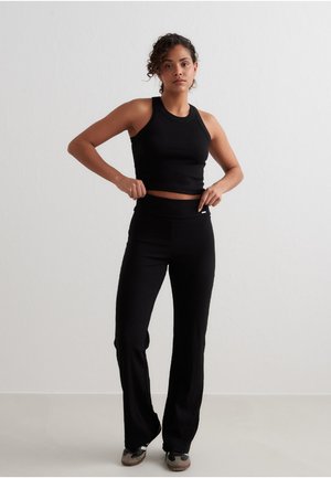 aim’n® EASE RIBBED - Trousers - black