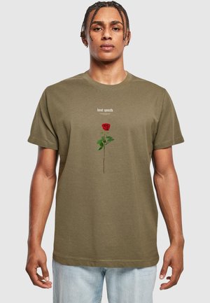 Olive green short-sleeve T-shirt featuring a red rose graphic with green leaves and the text "lost youth" above in a light font. Casual fit.