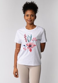 Graues Baumwoll-T-Shirt mit einem pinken und türkisfarbenen floralen Design. Kurze Ärmel, runder Halsausschnitt und lockere Passform. Angenehme Textur.